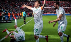 Werder Bremen’s Max Kruse celebrates with his teammates after scoring his side’s third goal in injury time.