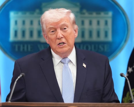 Donald Trump speaks to reporters at the White House.