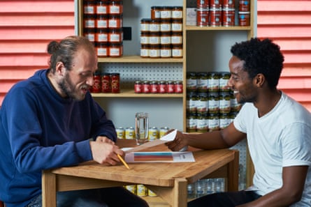 Two people sat at a table in a restaurant
