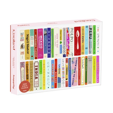 Jigsaw box showing illustration of colourful cookbook spines in 2 rows