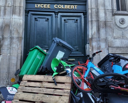 Entrance to school blocaded with bins and hire bikes.