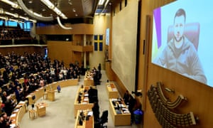 Ukraine’s President Volodymyr Zelenskiy addresses the Swedish parliament via videolink after thanking European Council members for putting sanctions on Russia, albeit being ‘a little late’