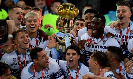 Lazio’s players celebrate as they hold the trophy after beating Atalanta at the Stadio Olimpico.