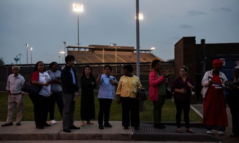 Voters wait in line to cast their ballots in the Democratic primary at a polling station in Houston, Texas, last year.