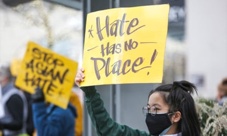 A student who wished to remain anonymous, holds a sign that reads “hate has no place” during the We Are Not Silent rally organized by the Asian American Pacific Islander (AAPI) Coalition Against Hate and Bias in Bellevue, Washington on March 18, 2021.
