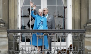 Queen Margrethe and Prince Henrik wave from the balcony at her 76th birthday celebrations last April.