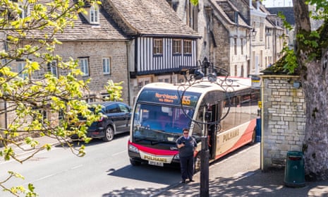 a bus stop and bus in the Cotswolds, England