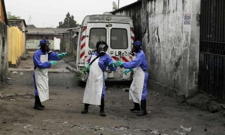 Members of a Médecins Sans Frontières team fumigate the Yolo Sud neighbourhood of Kinshasa.