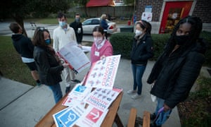 Poll workers prepare signs before polls open on November 3, 2020 in Columbia, South Carolina.