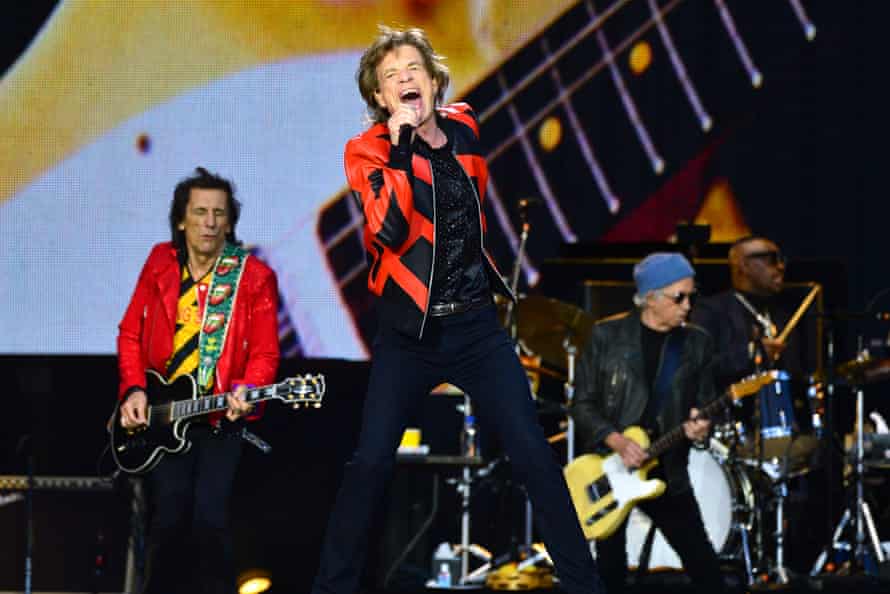 Mick Jagger flanked by Ronnie Wood and Keith Richards, plus drummer Steve Jordan.