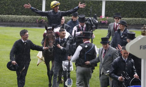 Frankie Dettori celebrates on Crystal Ocean after winning the Prince of Wales’ Stakes.