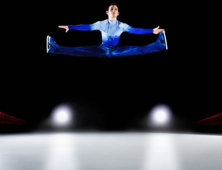 Figure skater performs a split in the air