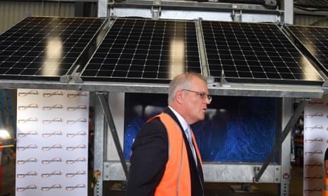 Scott Morrison in front of solar panels