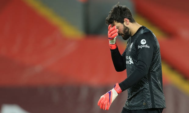 Alisson can’t believe it after he gifted Manchester City two chances which they took to go from 1-1 to 3-1 in front.