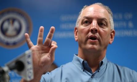 Louisiana governor John Bel Edwards discusses the flooding at a press conference.