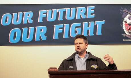 Jon Holden, the IAM District 751 president, speaks after striking workers voted to accept Boeing's latest offer