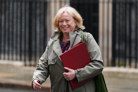 Alexander in Downing Street with red file.