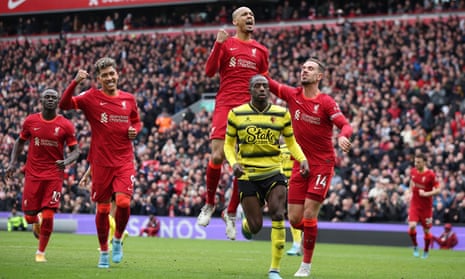 Liverpool's Fabinho celebrates scoring their second goal with Jordan Henderson and Roberto Firmino .