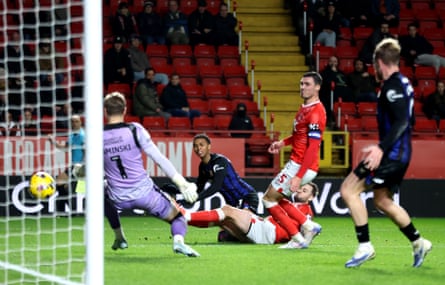 Middlesbrough's Morgan Whittaker (second left) slides in to score their second goal at Charlton