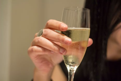 Woman hand holding a glass of wine