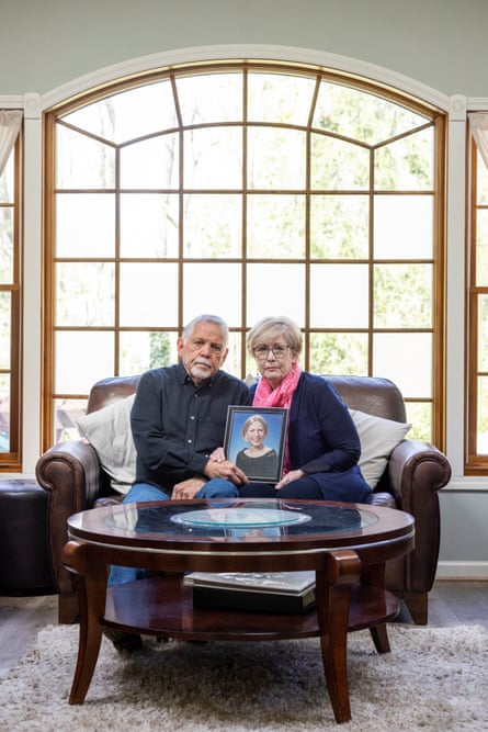 Jack and Linda Mazur hold a photograph of their daughter, Emilee, at home in Penfield, New York.