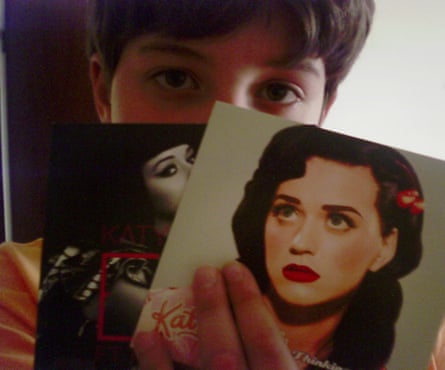 A 10-year-old Pedro João Santos holding his prized Katy Perry singles.