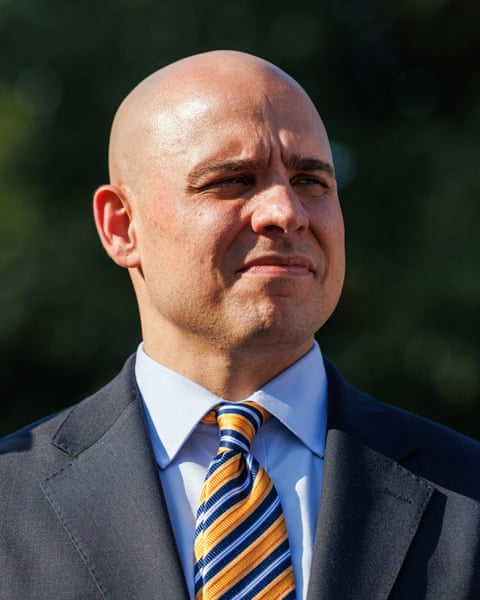 a man looks off to the side