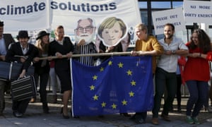 Environmental activists protest outside the EU Council in Brussels. Europe is poised to take the lead in global efforts against climate change.