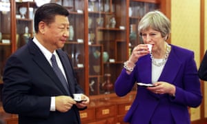 British Prime Minister Theresa May (R) drinks from a cup as she stands next to Xi Jinping, China’s president, during a tea ceremony in Beijing, China 4000.jpg?width=300&quality=85&auto=forma