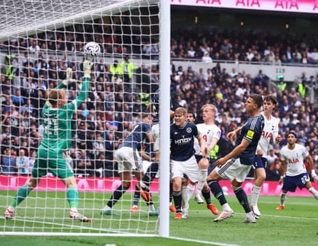 Newcastle keeper Lukas Hornicek saves a header Jan Paul van Hecke of Tottenham Hotspur.