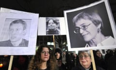 Activists demonstrate with photos of journalists, including Politkovskaya (right), who have been gunned down in Moscow since 2006. 