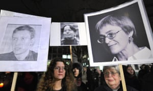 Activists demonstrate with photos of journalists, including Politkovskaya (right), who have been gunned down in Moscow since 2006.