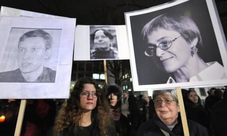 Reporters without Borders activists demonstrate in Berlin in 2009 with images of human rights lawyer Stanislav Markelov, and Novaya Gazeta journalists Anastasia Baburova and Anna Politkovskaya.