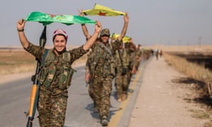 Kurdish fighters celebrate in Tel Abyad in the Raqqa governorate of Syria after they said they took control of the area in June.