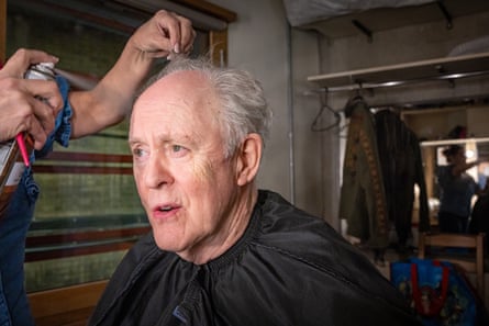 John Lithgow has his hair done