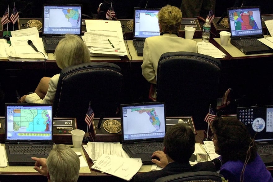 Florida state representatives look at redistricting plans on their computers during a hearing in March 2002.