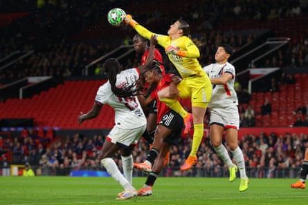 Mary Earps of Paris Saint-Germain punches the ball clear during a Women’s Champions League game at Manchester United