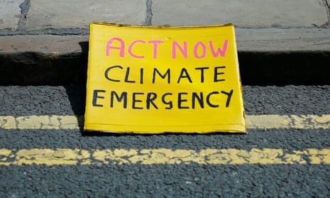 Sign reading Act Now Climate Emergency