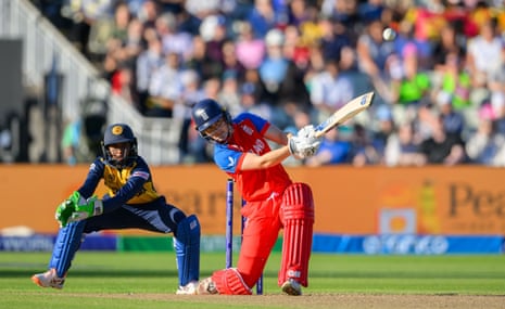 Amy Jones of England Women clubs the ball down the ground off a free hit for four runs .