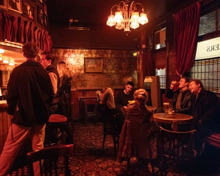 People drinking in a pub