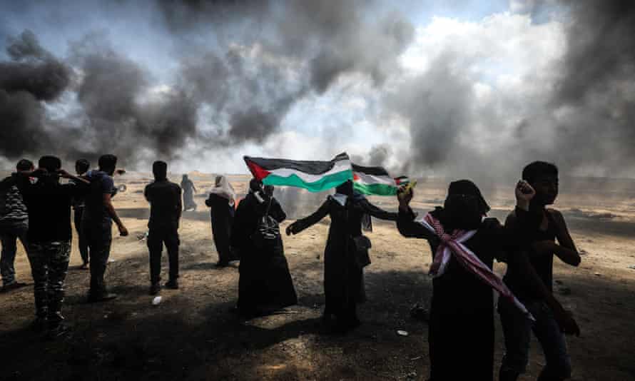 Palestinians set tyres on fire near Gaza-Israel border in Khan Yunis, Gaza.