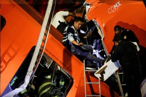 Rescuers work at the site