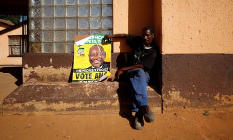 An ANC supporter with a poster of President Cyril Ramaphosa