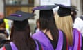 Three women wearing caps and gowns at university graduation