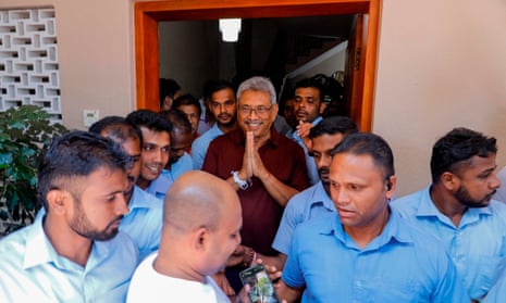 Gotabaya Rajapaksa gestures to supporters and well-wishers outside his house in Colombo.