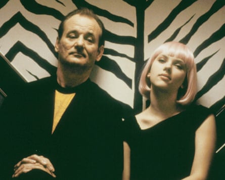 Actors in front of zebra skin patterned wall