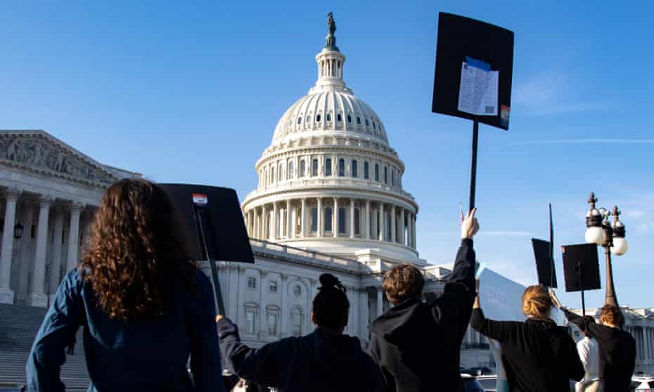 Demonstrators with the Sunrise Movement and MoveOn organizations protest outside the US Capitol on 17 November 2021 in Washington DC. 