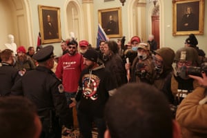 Protesters interact with Capitol Police inside the U.S. Capitol Building.