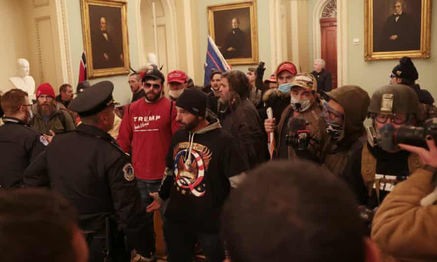 Protesters confront Capitol police on 6 January.