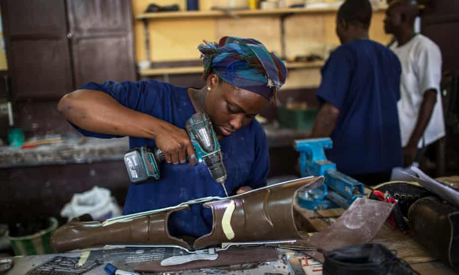 A worker constructs a polyethylene orthoses at the Physical Rehabilitation Project (PRP) in Bangui, Central African Republic.